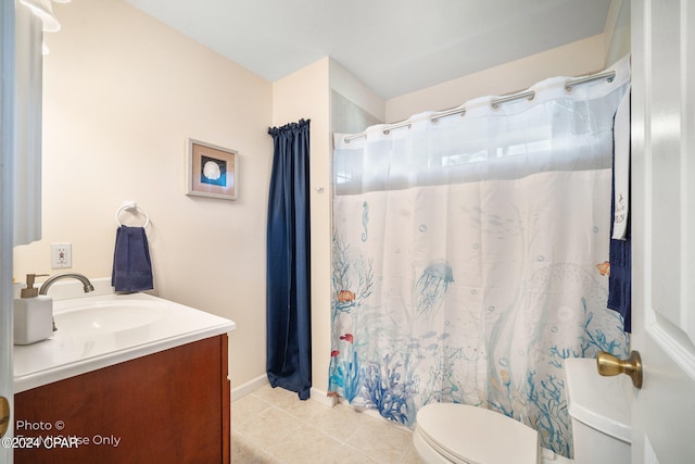 bathroom featuring tile patterned floors, walk in shower, vanity, and toilet