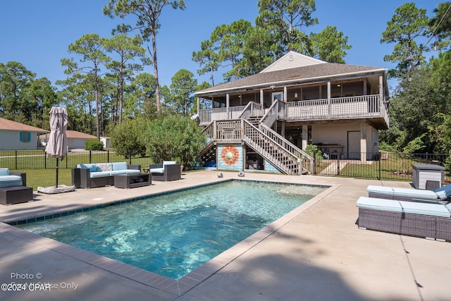 view of swimming pool featuring a patio area and an outdoor living space