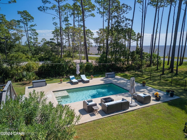 view of swimming pool with a yard and a patio