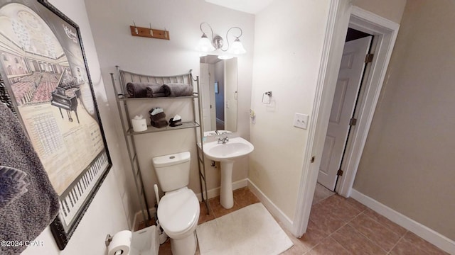 bathroom featuring toilet and tile patterned floors