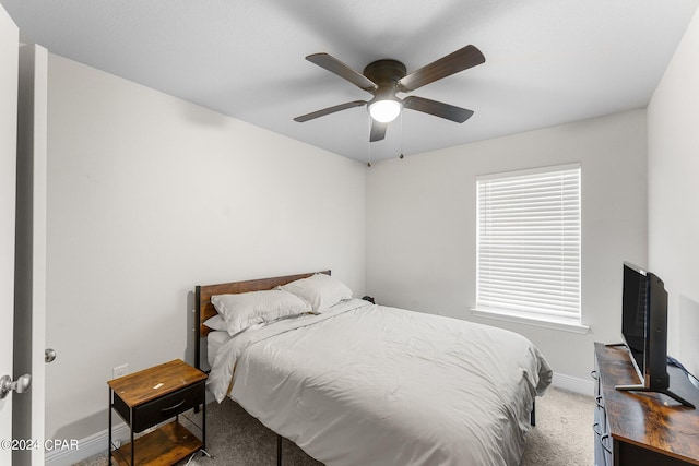 bedroom featuring ceiling fan and carpet