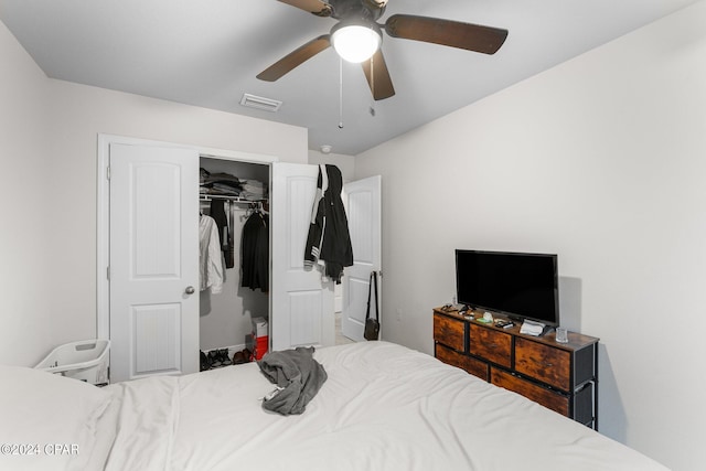 bedroom with ceiling fan and a closet