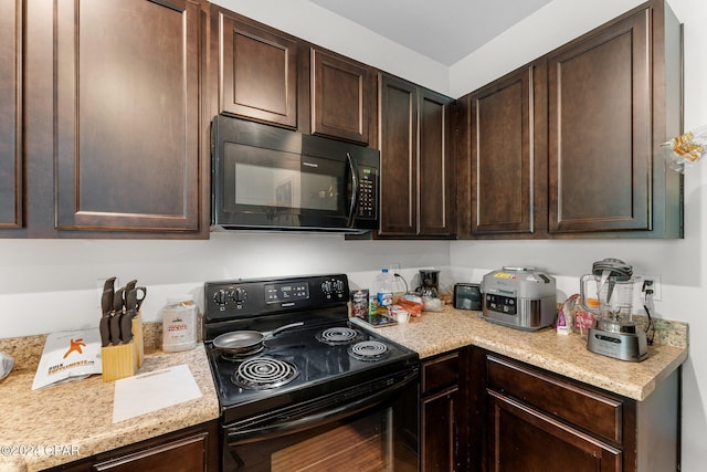 kitchen with dark brown cabinetry and black appliances