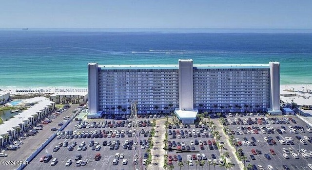 aerial view featuring a water view and a beach view