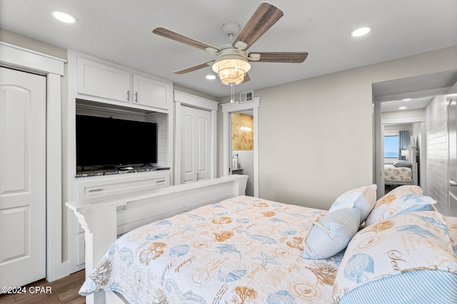 bedroom featuring dark hardwood / wood-style flooring and ceiling fan