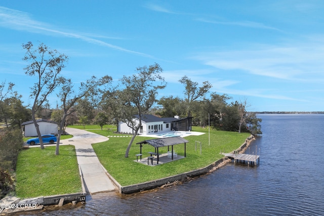 exterior space with a water view and a yard