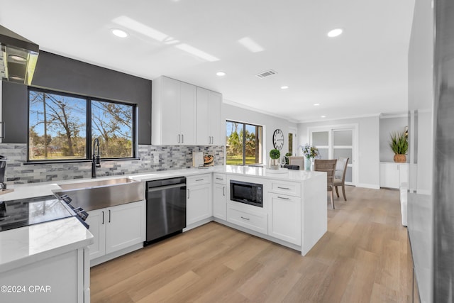 kitchen featuring black microwave, light hardwood / wood-style flooring, dishwasher, kitchen peninsula, and white cabinets