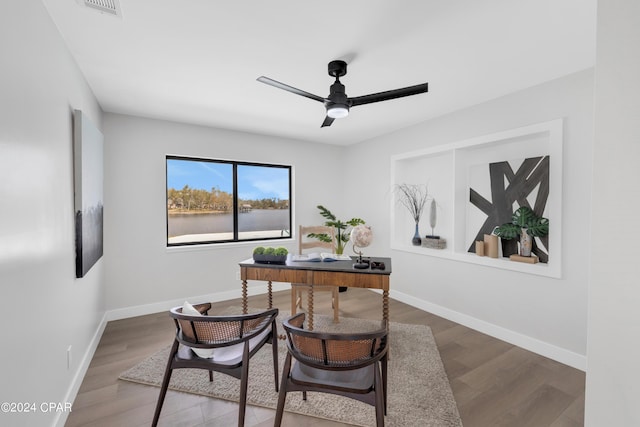 home office with ceiling fan and wood-type flooring