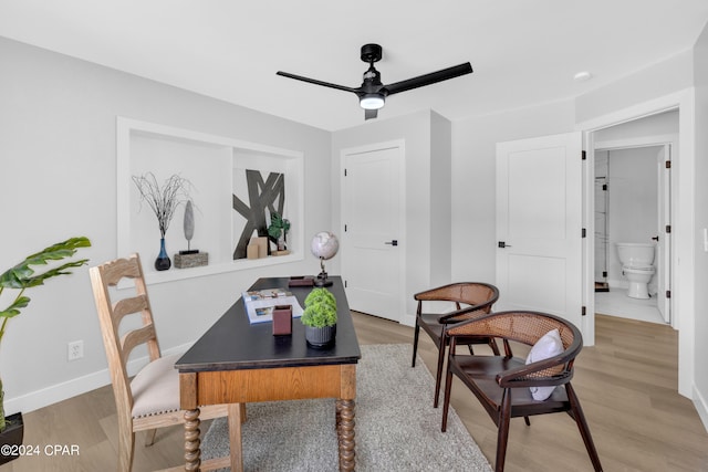 office space with light hardwood / wood-style flooring and ceiling fan