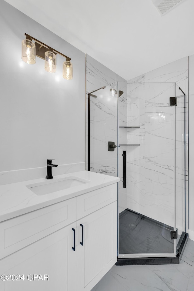 bathroom featuring walk in shower and vanity