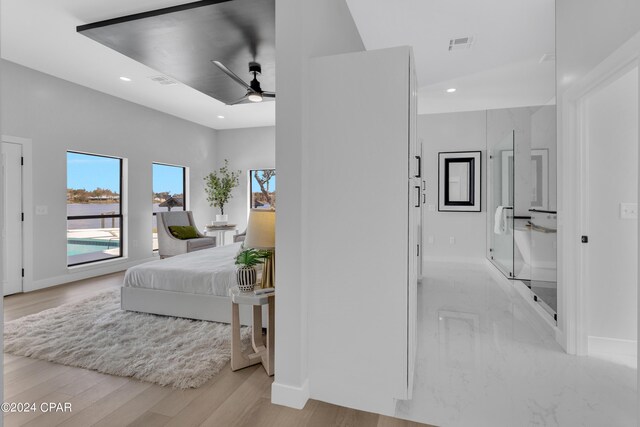 bedroom featuring ceiling fan and light hardwood / wood-style flooring