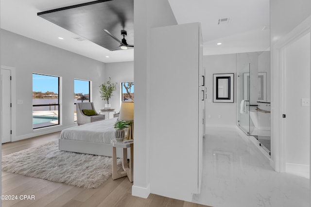 bedroom featuring ceiling fan and light wood-type flooring