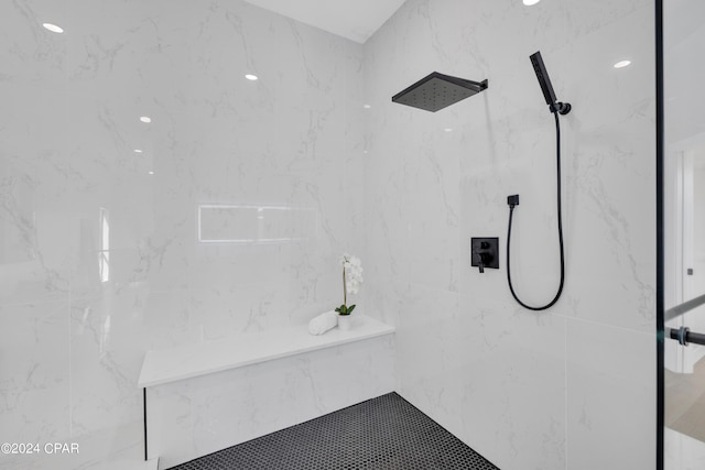 bathroom featuring a tile shower