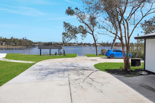 view of patio / terrace with a water view, a gazebo, and central air condition unit