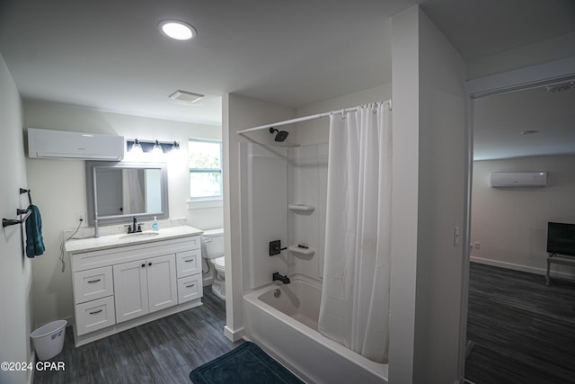 full bath featuring wood finished floors, toilet, a wall unit AC, and vanity