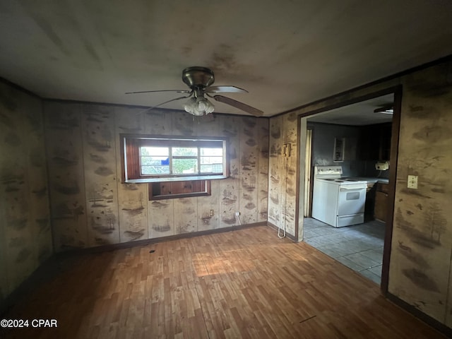 empty room featuring ceiling fan and light hardwood / wood-style floors