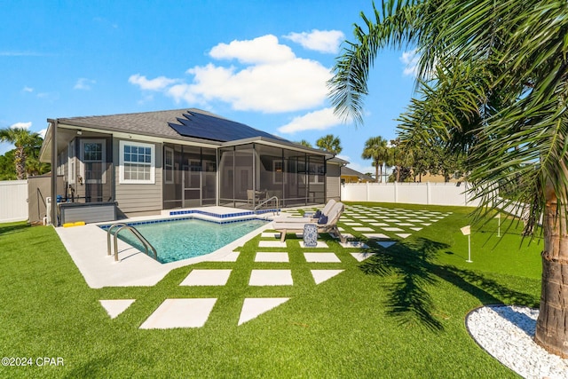 view of pool featuring a sunroom, a yard, and a patio area