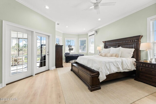 bedroom featuring ceiling fan, light wood-type flooring, and multiple windows