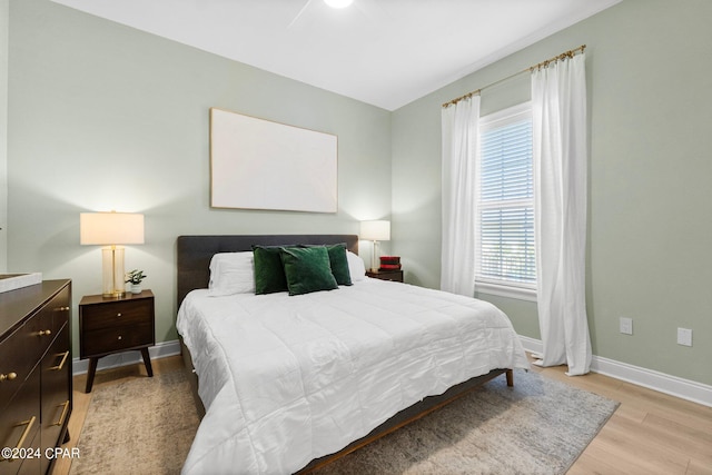 bedroom featuring ceiling fan and light hardwood / wood-style floors