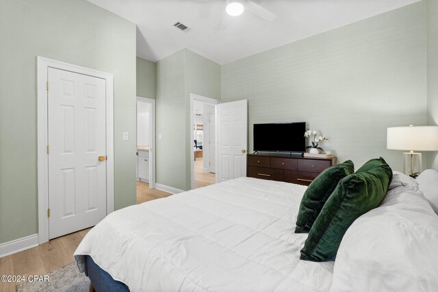 bedroom with ceiling fan and light wood-type flooring