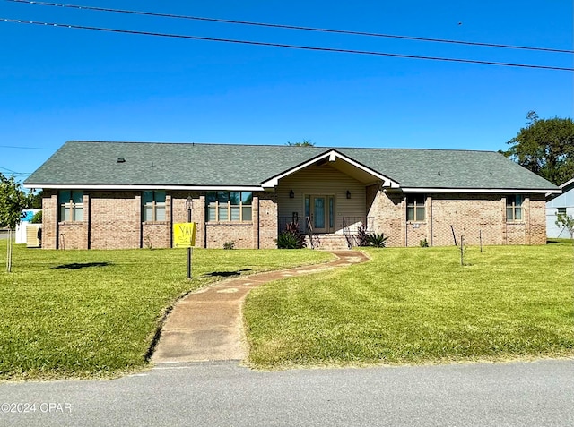 ranch-style home with a front yard