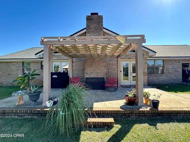 back of house featuring a yard and a patio