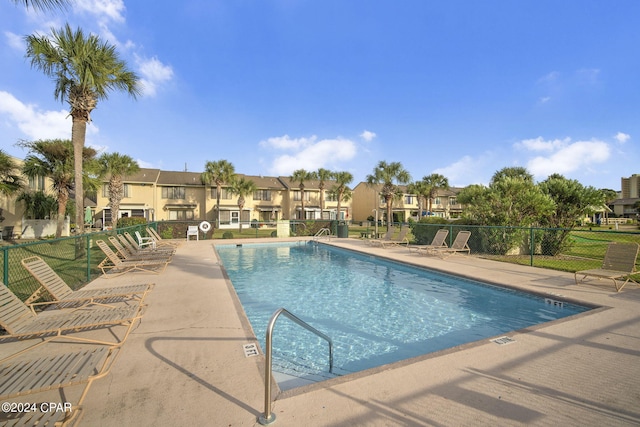 view of swimming pool with a patio area