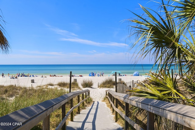 property view of water featuring a beach view