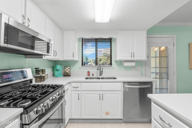 kitchen with sink, white cabinetry, and stainless steel appliances