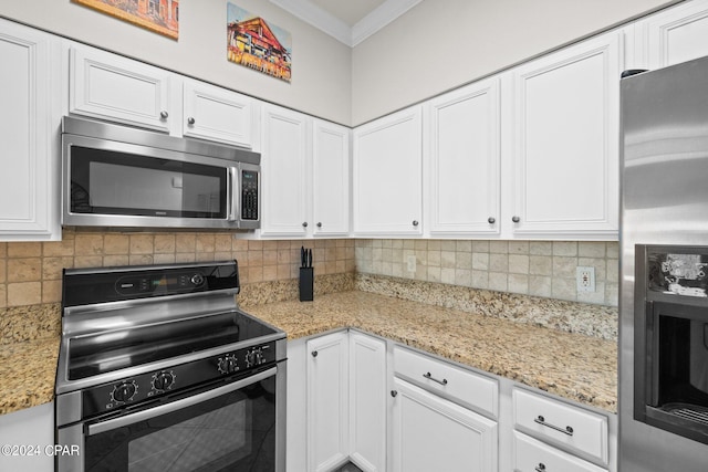 kitchen with white cabinetry, crown molding, appliances with stainless steel finishes, and decorative backsplash