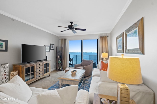 tiled living room with ceiling fan and ornamental molding