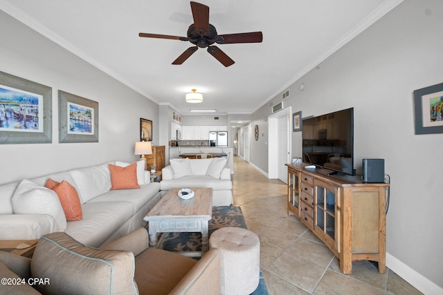 living room with crown molding, light tile patterned floors, and ceiling fan