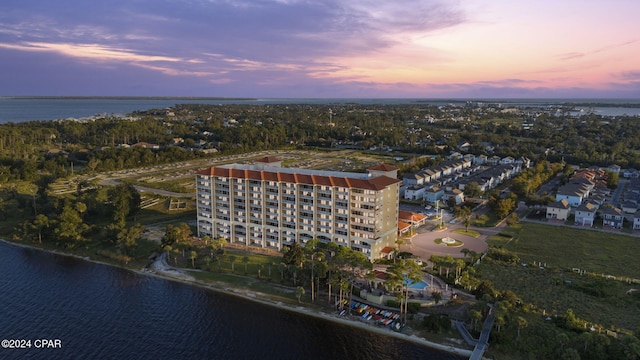 aerial view at dusk with a water view