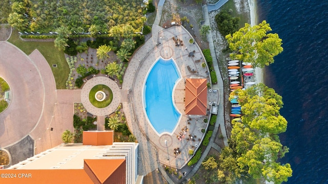 birds eye view of property with a water view