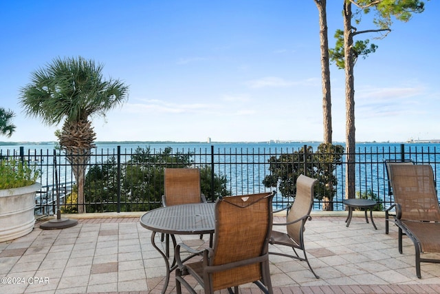 view of patio with a water view