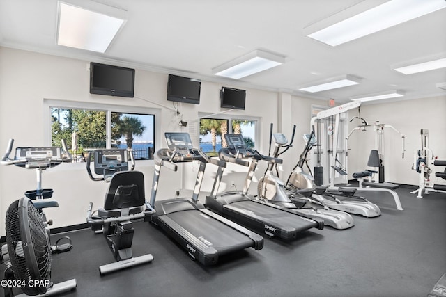 exercise room featuring ornamental molding