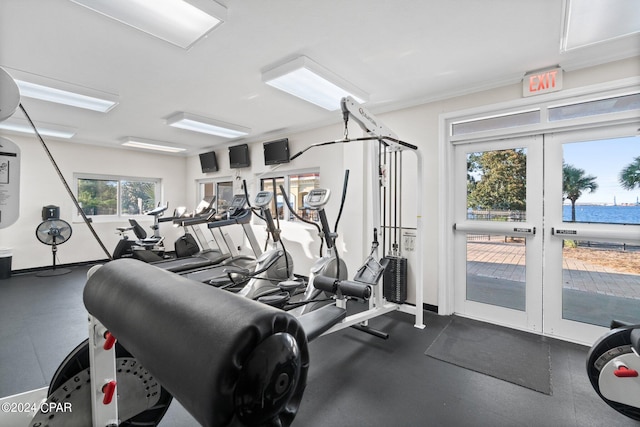 exercise room with ornamental molding and french doors