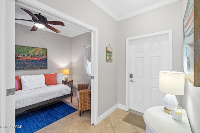 tiled entryway featuring ornamental molding and ceiling fan