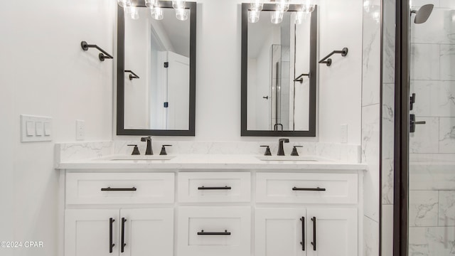 bathroom with walk in shower and vanity