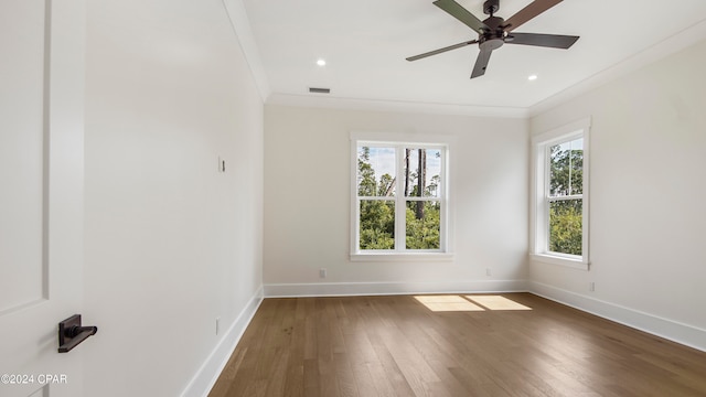 unfurnished room with ornamental molding, ceiling fan, and dark hardwood / wood-style flooring