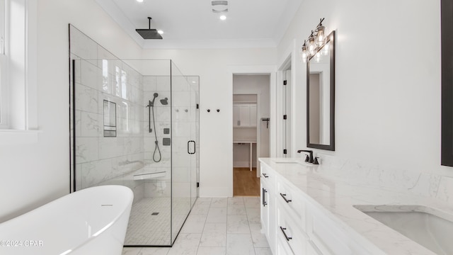 bathroom featuring vanity, crown molding, and separate shower and tub