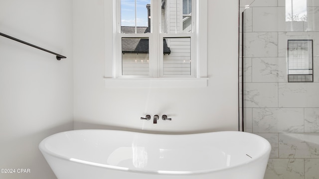 bathroom featuring a bath