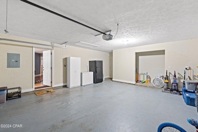 garage featuring a garage door opener, black fridge, electric panel, and white fridge