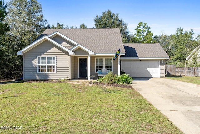 view of front of house with a garage and a front lawn