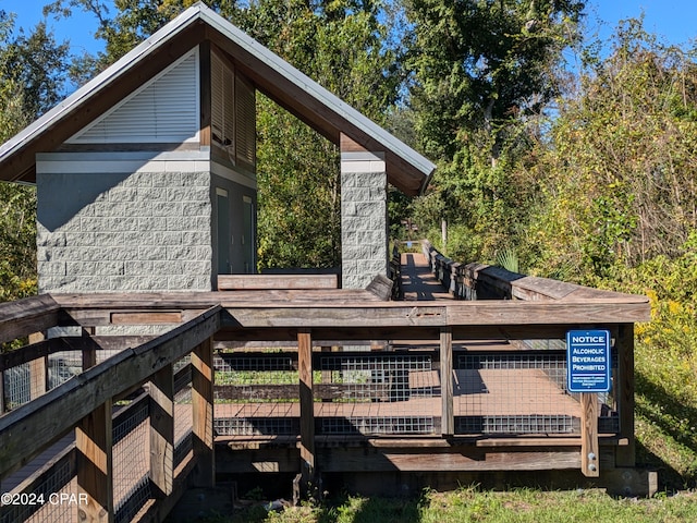 wooden deck featuring an outdoor structure