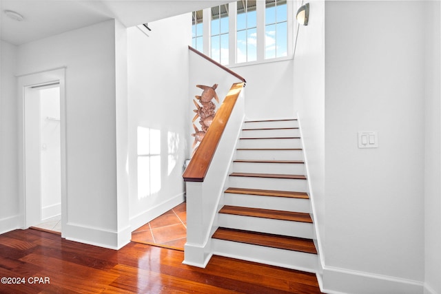 stairway featuring hardwood / wood-style floors