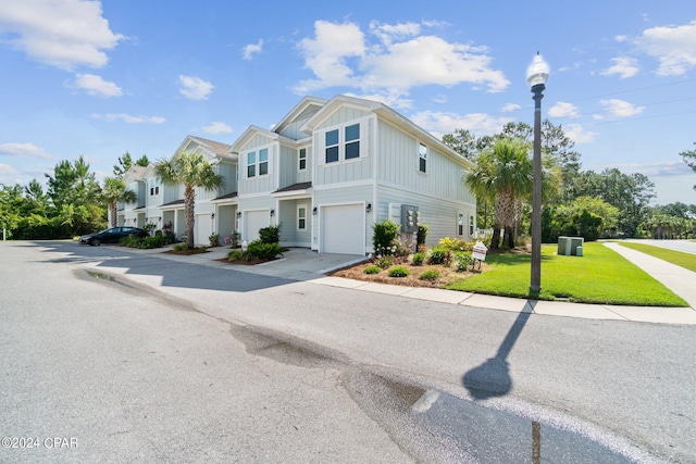 view of front facade with a front yard and a garage