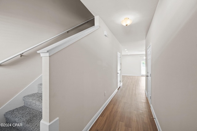 corridor featuring wood-type flooring