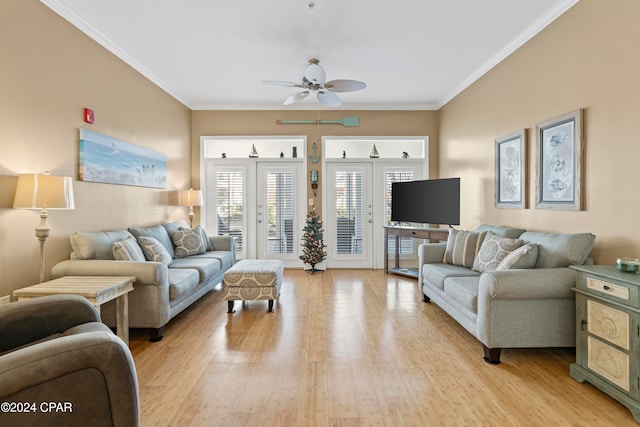 living room featuring ceiling fan, french doors, ornamental molding, and light wood-type flooring