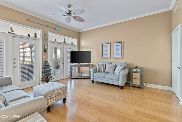 living room with french doors, light wood-type flooring, ceiling fan, and ornamental molding